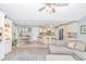Open concept living room showcasing kitchen, dining area, and living space with natural light at 5 Old Barge Dr., Pawleys Island, SC 29585