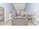Bright open-concept living space with vaulted ceilings flows into the dining area, enhanced by neutral tones and modern furnishings at 5 Old Barge Dr., Pawleys Island, SC 29585