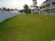 Community backyard with ample green space and fence at 500 Fairway Village Dr. # 7-C, Myrtle Beach, SC 29588