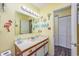 Bright bathroom with a large mirror, vanity and nautical decor at 500 Fairway Village Dr. # 7-C, Myrtle Beach, SC 29588