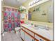 Bathroom featuring a shower with a colorful curtain, vanity and nautical themed decor at 500 Fairway Village Dr. # 7-C, Myrtle Beach, SC 29588