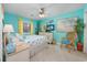 Bright bedroom featuring a queen bed, ceiling fan, and a coastal-themed decor at 500 Fairway Village Dr. # 7-C, Myrtle Beach, SC 29588