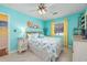 Comfortable bedroom with a queen bed, ceiling fan, and bright, colorful decor at 500 Fairway Village Dr. # 7-C, Myrtle Beach, SC 29588