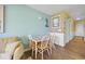 Open dining area adjacent to a living room with a table set for four at 500 Fairway Village Dr. # 7-C, Myrtle Beach, SC 29588
