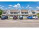 Inviting townhomes featuring neutral siding, complemented by convenient parking spaces and attractive landscaping at 500 Fairway Village Dr. # 7-C, Myrtle Beach, SC 29588