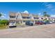 Inviting townhomes featuring neutral siding, complemented by convenient parking spaces and attractive landscaping at 500 Fairway Village Dr. # 7-C, Myrtle Beach, SC 29588