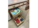 Convenient kitchen organization with pull-out storage for towels and dishware in lower cabinets at 500 Fairway Village Dr. # 7-C, Myrtle Beach, SC 29588