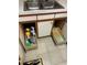 Organized under-sink kitchen storage cabinet with pull-out containers for cleaning supplies at 500 Fairway Village Dr. # 7-C, Myrtle Beach, SC 29588