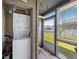 Close up view of sunroom laundry machines and a view of the lawn at 500 Fairway Village Dr. # 7-C, Myrtle Beach, SC 29588