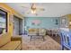 Spacious living room with a sliding glass door, cozy seating, and a dining area for entertaining at 500 Fairway Village Dr. # 7-C, Myrtle Beach, SC 29588
