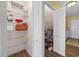 View of a shelved storage area and doorway showing additional storage space or access at 500 Fairway Village Dr. # 7-C, Myrtle Beach, SC 29588