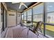 Enclosed sun room with seating, a glass table, and view to the backyard at 500 Fairway Village Dr. # 7-C, Myrtle Beach, SC 29588