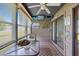 Relaxing sunroom with large windows, overhead storage, and stylish decor at 500 Fairway Village Dr. # 7-C, Myrtle Beach, SC 29588