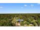 Aerial view of the home at 509 S Rosemary Ave surrounded by mature trees and other homes at 509 S Rosemary Ave., Andrews, SC 29510
