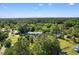 Aerial view showcasing the property's location amidst lush greenery and neighboring homes, 509 S Rosemary Ave at 509 S Rosemary Ave., Andrews, SC 29510