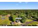Aerial view of the home at 509 S Rosemary Ave with well-maintained landscaping and a surrounding tree line at 509 S Rosemary Ave., Andrews, SC 29510
