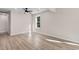 Spacious bedroom featuring wood-look flooring, natural light from a large window and a ceiling fan at 509 S Rosemary Ave., Andrews, SC 29510