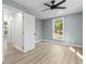 Comfortable bedroom with plenty of natural light, ceiling fan, and neutral color scheme at 509 S Rosemary Ave., Andrews, SC 29510