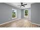 Bedroom featuring light blue walls, light wood flooring, and a ceiling fan at 509 S Rosemary Ave., Andrews, SC 29510