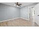 Bright bedroom featuring luxury vinyl plank flooring and neutral colored walls at 509 S Rosemary Ave., Andrews, SC 29510
