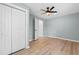 Bright bedroom featuring luxury vinyl plank flooring and a double door closet at 509 S Rosemary Ave., Andrews, SC 29510