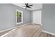 Cozy bedroom with modern ceiling fan, double door closet, and luxury vinyl plank flooring at 509 S Rosemary Ave., Andrews, SC 29510
