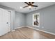 Comfortable bedroom featuring laminate flooring, natural light, and a modern ceiling fan at 509 S Rosemary Ave., Andrews, SC 29510