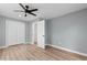 Bright bedroom featuring luxury vinyl plank flooring and a double door closet at 509 S Rosemary Ave., Andrews, SC 29510