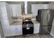 Modern kitchen featuring white cabinets, stainless steel appliances, and granite countertops at 509 S Rosemary Ave., Andrews, SC 29510