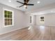 Spacious, bright living room with modern ceiling fan and luxury vinyl plank flooring at 509 S Rosemary Ave., Andrews, SC 29510