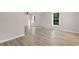 Spacious living room with laminate flooring, natural light, and neutral color scheme at 509 S Rosemary Ave., Andrews, SC 29510