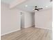 Light and airy living room featuring a ceiling fan and light-colored laminate flooring at 509 S Rosemary Ave., Andrews, SC 29510