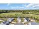 Lovely aerial view of houses with green space; featuring a well-manicured lawn and inviting curb appeal at 534 War Eagle Ct., Conway, SC 29526