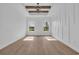 Spacious bedroom featuring hardwood floors, decorative wall trim, and large windows at 534 War Eagle Ct., Conway, SC 29526