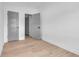 Modern bedroom with hardwood floors, white walls, and paneled doors leading to other rooms at 534 War Eagle Ct., Conway, SC 29526