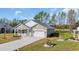 Beautiful single-story home featuring a white brick facade, attached garage, and well-maintained lawn at 534 War Eagle Ct., Conway, SC 29526