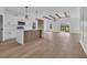 Modern kitchen featuring stainless appliances, wooden kitchen island, open to a well lit living area at 534 War Eagle Ct., Conway, SC 29526