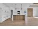 Stylish kitchen with sleek white cabinets, wooden island, and stainless steel appliances at 534 War Eagle Ct., Conway, SC 29526