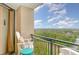 Balcony with outdoor seating, overlooking the lush landscape at 5523 N Ocean Blvd. # 1201, Myrtle Beach, SC 29577