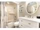 Bright bathroom featuring a vanity with marble countertop and a shower-tub combo at 5523 N Ocean Blvd. # 1201, Myrtle Beach, SC 29577