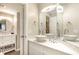 Modern bathroom with marble countertop vanity and separate wash basin; adjacent bathroom visible at 5523 N Ocean Blvd. # 1201, Myrtle Beach, SC 29577