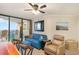 Living room with balcony access featuring ocean views and comfortable seating at 5523 N Ocean Blvd. # 1201, Myrtle Beach, SC 29577