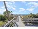 Wooden walkway leading to the beach, surrounded by lush landscaping at 5523 N Ocean Blvd. # 1201, Myrtle Beach, SC 29577