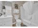 Bathroom with white cabinets, neutral wallpaper, a white toilet, and a shower with a white curtain at 5801 Oyster Catcher Dr. # 1621, North Myrtle Beach, SC 29582
