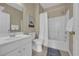 Bathroom featuring a vanity sink, toilet, and tub with a shower and white curtain at 5801 Oyster Catcher Dr. # 1621, North Myrtle Beach, SC 29582