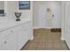 Hallway with decorative sign, cream-colored walls, and ceramic tile flooring at 5801 Oyster Catcher Dr. # 1621, North Myrtle Beach, SC 29582