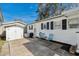A backyard with chairs and a storage shed at 6001- 1776 S Kings Highway, Myrtle Beach, SC 29575