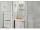 A bathroom with a vanity, mirror, and convenient storage at 6001- 1776 S Kings Highway, Myrtle Beach, SC 29575