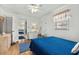 Cozy bedroom with a queen bed, blue accents, and natural light from the window for a serene retreat at 6001- 1776 S Kings Highway, Myrtle Beach, SC 29575