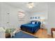 Comfortable bedroom with blue bedding, a ceiling fan, and bright decor for a relaxing atmosphere at 6001- 1776 S Kings Highway, Myrtle Beach, SC 29575